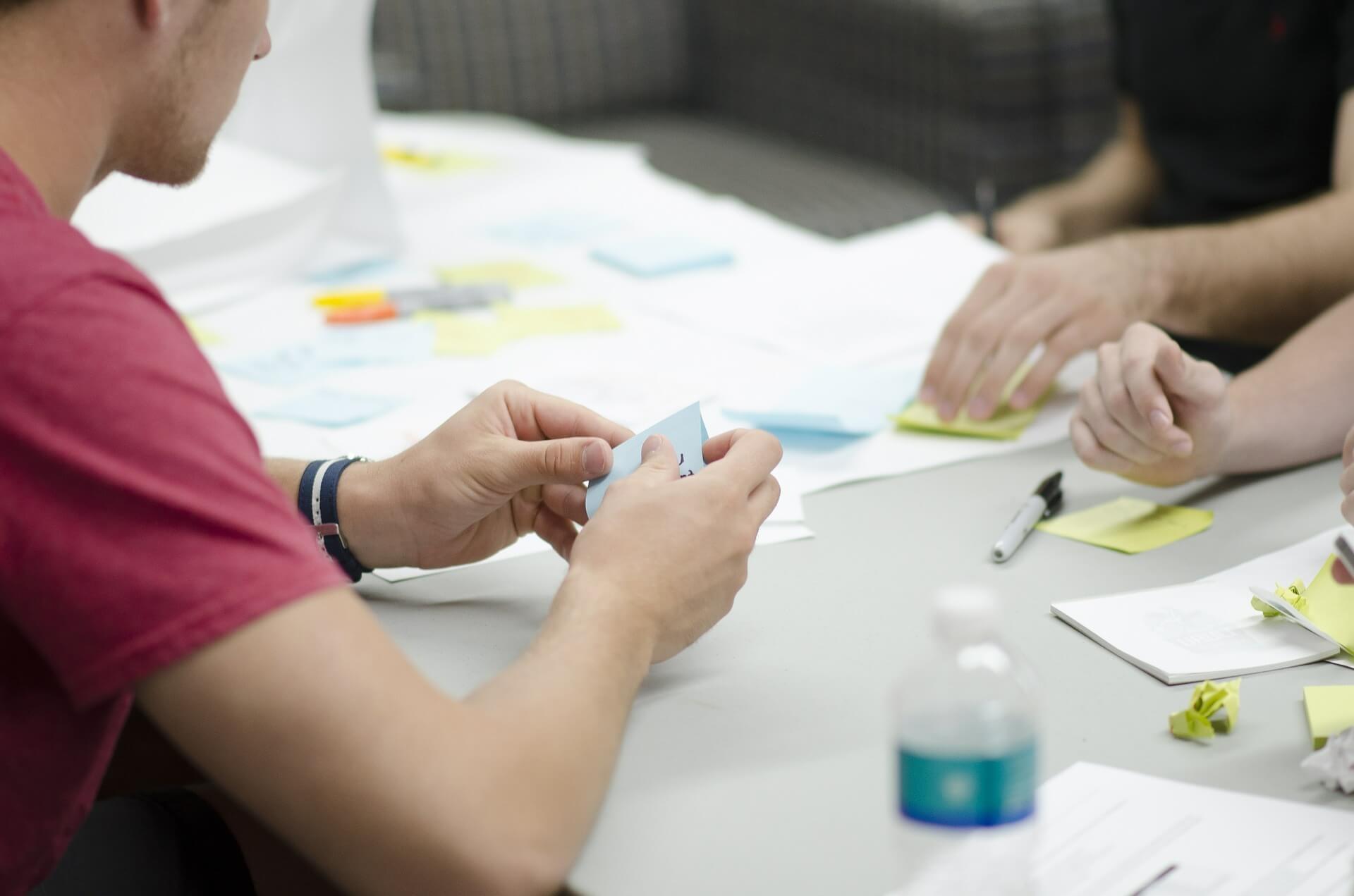 Employees working with sticky notes-1